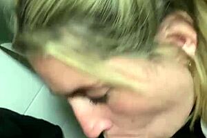 DEEPTHROAT SLUT BLONDE SUCKS COCK IN PUBLIC CINEMA BATHROOM