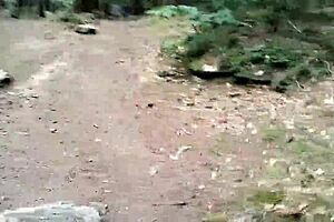 Shemale strokes glass dildo on road