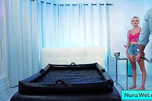 Busty Blonde Masseuse Glides Nuru Gel Over Petite Body on Client