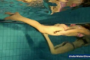 Horny Czech blondes rip bikinis and strip nude in pool underwater