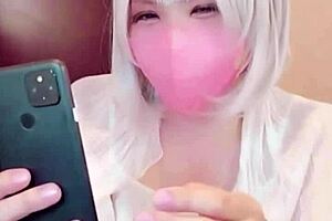 masked asian ladyboy crossdresses masturbates on cam solo