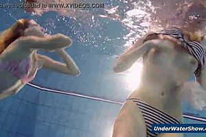 Horny Czech blondes rip bikinis and strip nude in pool underwater