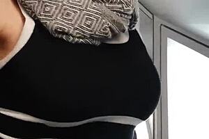 A flirty babe teases riders on the crowded train.