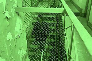 Dominatrix mistress April brutally strapons bound slaves in military camp