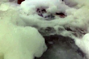 Curvy Brunette Sensually Bubbles in Foamy Bathtub Tease